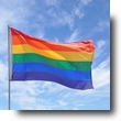 Gay Pride Flag Pole Waving in Blue Cloudscape Sky